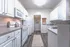 Kitchen with white cabinets at Abberly Place Apartments in Garner, NC