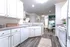 Kitchen with Ample Cabinets and Bar at Abberly Place Apartments in Garner, NC
