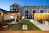Courtyard featuring cornhole and ample lounge chairs at Abberly Liberty Crossing Apartments in Charlotte, NC