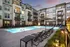 Resort Style Swimming Pool at dusk at Abberly Liberty Crossing Apartments in Charlotte, NC