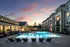 Resort Style Swimming Pool at dusk at Abberly Liberty Crossing Apartments in Charlotte, NC