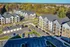 An aerial view of modern apartment buildings at Abberly Liberty Crossing Apartments in Charlotte, NC