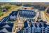 An aerial view of modern apartment buildings at Abberly Liberty Crossing Apartments in Charlotte, NC