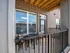 A patio featuring a table and chairs, providing a cozy outdoor seating area for relaxation and socializing at Abberly Liberty Crossing Apartments in Charlotte, NC