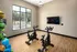 Exercise Room featuring two bikes and a TV mounted on the wall at Abberly Liberty Crossing Apartments in Charlotte, NC