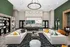 A clubhouse featuring a demonstration kitchen and comfortable couches arranged for socializing and relaxation at Abberly Liberty Crossing Apartments in Charlotte, NC