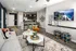 A cozy living room at Abberly Liberty Crossing Apartment Homes in Charlotte, featuring a comfortable couch and a stylish table. The space is well-lit and inviting, perfect for relaxation and socializing.