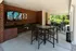 Shaded Outside Sitting Area with TV at Abberly Village Apartments in West Columbia, SC
