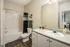 White on White Bathroom Cabinetry at Abberly Woods Apartments in Charlotte, NC