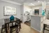 Dining Area and Kitchen with Bar Seating at Abberly Woods Apartments in Charlotte, NC
