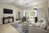 Large Living Room with Ceiling Fan at Abberly Woods Apartments in Charlotte, NC