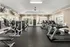 Spacious fitness center featuring a variety of equipment, including treadmills, ellipticals, strength machines, and free weights at Abberly Woods Apartments in Charlotte, NC