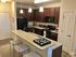 Mocha Wood Cabinets at Abberly at Southpoint Apartments in Fredericksburg, VA