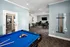 Game room with a pool table and a flat screen TV at Abberly Twin Hickory Apartments in Glen Allen, VA