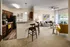 Modern and spacious living room with an open kitchen and dining area at Abberly Twin Hickory Apartments in Glen Allen, VA