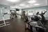 A room filled with various types of exercise equipment at Abberly Twin Hickory Apartments in Glen Allen, VA