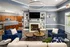 Cozy Lounge Area with Demonstration Kitchen at Abberly Twin Hickory Apartments in Glen Allen, VA