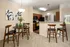 Modern kitchen and dining area at Abberly Twin Hickory Apartments in Glen Allen, VA