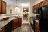 Modern kitchen and dining area at Abberly Twin Hickory Apartments in Glen Allen, VA