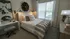 Cozy bed in bedroom with window at Abberly CenterPointe Apartments in Midlothian, VA