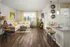 Living room with kitchen at Abberly Market Point Apartments in Greenville, SC