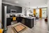 Modern kitchen and spacious living room at Abberly Noda Vista Apartments in Charlotte, NC