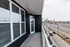 A balcony with a view of the city at Abberly Noda Vista Apartments in Charlotte, NC