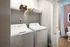 A washer and dryer in the laundry room at Abberly Noda Vista Apartments in Charlotte, NC