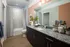 Modern bathroom with sleek fixtures and a spacious shower at Abberly Noda Vista Apartments in Charlotte, NC