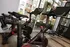 A row of exercise bikes in a gym at Abberly Noda Vista Apartments in Charlotte, NC