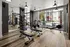 A workout room with weights and various exercise equipment at Abberly Noda Vista Apartments in Charlotte, NC