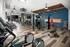 A spacious fitness room with cardio machines and various exercise equipment at Abberly Noda Vista Apartments in Charlotte, NC