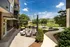 A patio with a table and chairs and a grilling area at Abberly Noda Vista Apartments in Charlotte, NC, 28206
