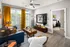 Our apartments offer a living room with a couch, coffee table, and TV at Abberly Noda Vista Apartments in Charlotte, NC