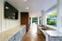 Outdoor Kitchen with TV at Abberly Green Apartments in Mooresville, NC