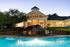 Pool with Clubhouse View at Abberly Green Apartments in Mooresville, NC