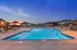 Poolside Sundeck with Relaxing Chairs at Abberly Avera Apartments in Manassas, VA