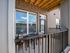 A patio featuring a table and chairs, providing a cozy outdoor seating area for relaxation and socializing at Abberly Alston Apartments in Cary, NC