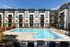 Resort Style Swimming Pool with lounge chairs at Abberly Alston Apartment Homes and Townhomes in Cary, NC