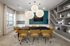 A conference room with a large black table, yellow chairs, and a blue accent wall at Abberly Alston Apartment Homes and Townhomes in Cary, NC
