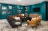 A resident lounge filled with furniture and a flat screen TV at Abberly Alston Apartment Homes and Townhomes in Cary, NC