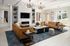 A resident clubhouse filled with furniture and a large chandelier at Abberly Alston Apartment Homes and Townhomes in Cary, NC