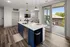 Stylish kitchen featuring white countertops and blue cabinets at Abberly Foundry Apartments in Nashville, TN