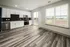 Modern kitchen featuring white cabinets and black and white appliances at Abberly Foundry Apartments in Nashville, TN