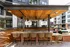 Patio featuring a bar and a pool in front of a building at Abberly Foundry Apartments in Nashville, TN