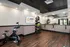 Modern gym with large mirrors and stationary bikes, perfect for fitness enthusiasts at Abberly Foundry Apartments in Nashville, TN