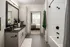 Elegant bathroom featuring white tile walls, a black countertop with a sink, and a bathtub at Abberly Foundry Apartments in Nashville, TN