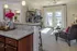 Spacious Living Room With Private Balcony at Abberly Square Apartments in Waldorf, MD