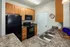 Kitchen with Black Appliances at Abberly Crossing Apartments in Ladson, SC