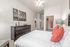 Cozy bedroom with a large bed and a dresser at Abberly Crest Apartments in Lexington Park, MD
